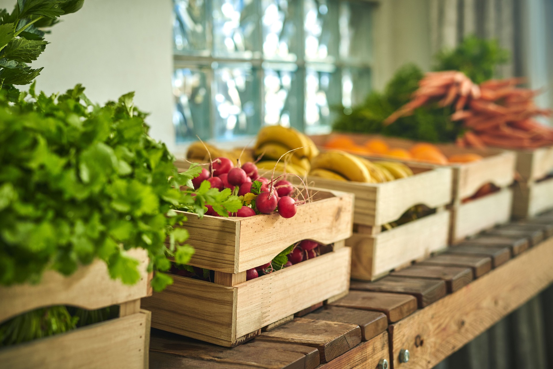 Shot of freshly picked produce in a crate a farmer’s market